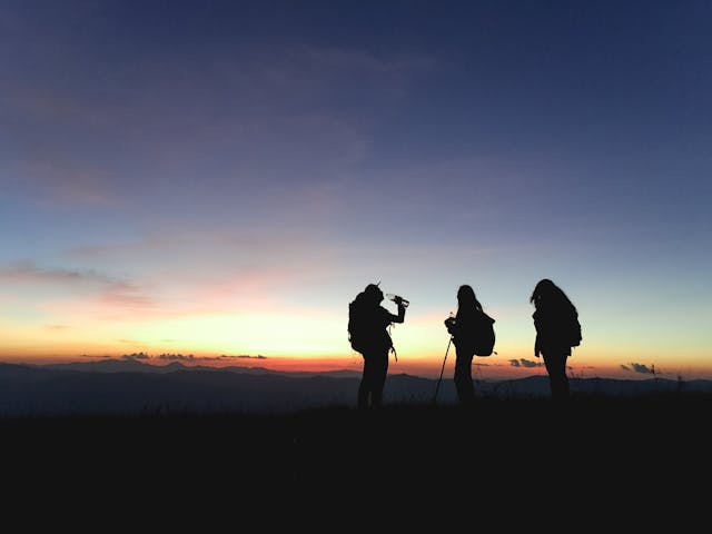 Why Is Hiking Good For You? -Silhouette of three hikers 