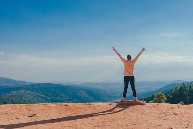 Hiking Goals For Beginners - Hiker looking at a view