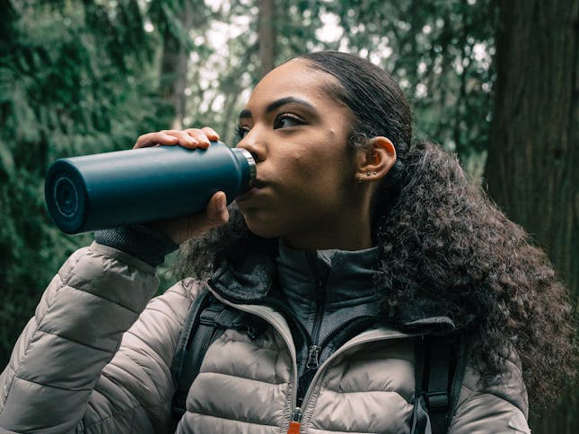 How To Stay Hydrated On A Hike - Hiker drinking