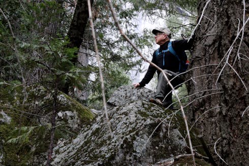 How To Hike On Rocky Terrain Safely - Man descending rocky slope