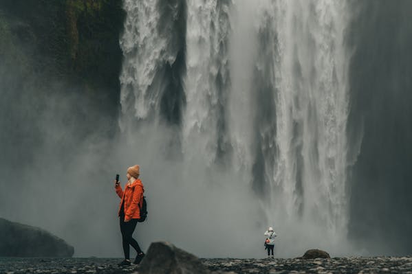How To Take Nature Photos - Hikers at a waterfall