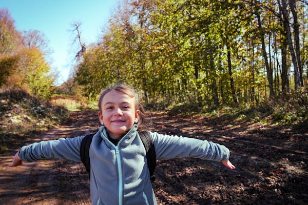 Safety Tips For Hiking With Children - Happy girl hiking